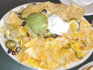 Nachos & cheese with jalapenos and guacamole