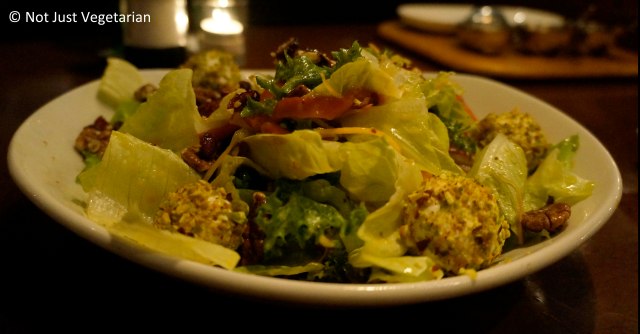 Fred's Salad with pistachio crusted goat cheese balls, walnuts, cranberries, and mixed lettuce in a mango-lychee dressing at Fred's House Seafood Market & Grill in Cancun