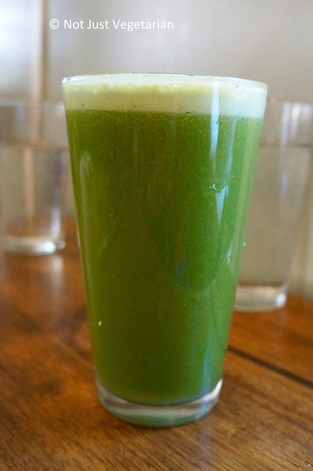 Green lemonade made of mixed greens, apple, lemon juice and ginger root at Peacefood Cafe NYC