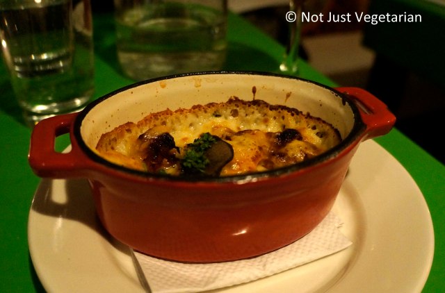 Gnocchi Parisian with truffles, artichokes, oven roasted tomatoes, Mornay sauce and Swiss cheese