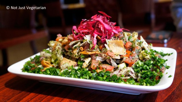 Fatoush - salad with tomatoes, onions, cucumber, parlsey, mint, toasted pita wedges, lemon juice, olive oil, and sumac - at Tanoreen NYC