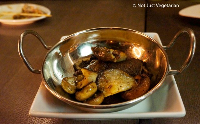 Roasted mushrooms with chopped herbs and truffle eesence at Barn Joo NYC
