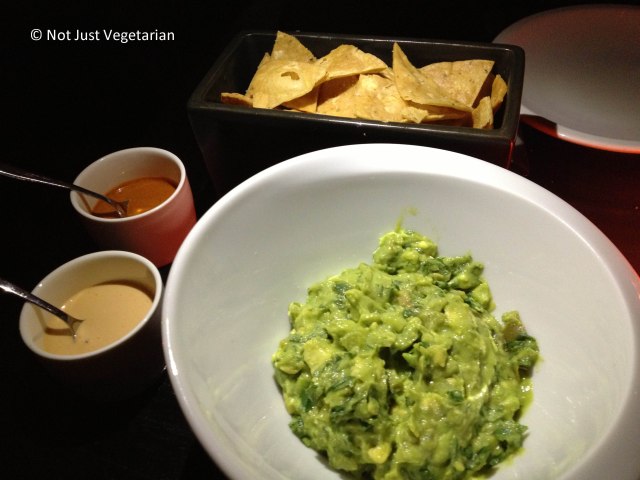 Guacamole served with smoked cashew salsa and arbol salsa and tortilla chips at Empellon Taqueria NYC