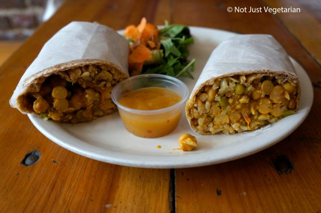 Curried cauliflower wrap with chick peas in a brown rice wrap served with Mango chutney at 'sNice cafe in the West Village in NYC