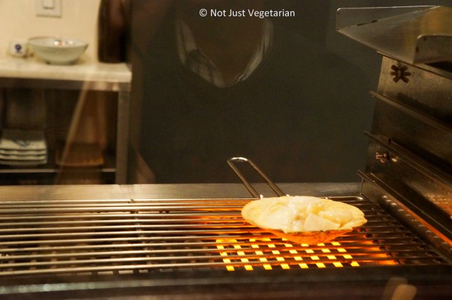 Scallops being grilled at Yopparai NYC