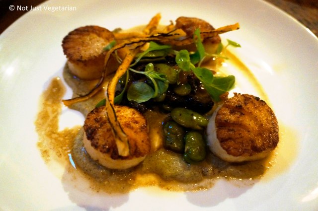 Scallops with fava, morels, salsify, and foie gras sabayon at Greenwich Project NYC