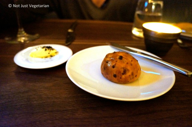 Bacon Brioche dinner roll served with butter and black maldon sea salt at Musket Room in NYC