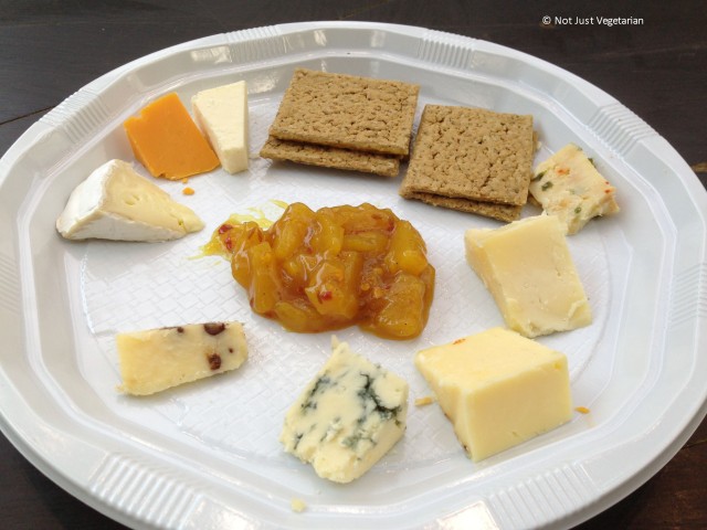 Cheese platter for one by the Truckle Cheese Co.  - Blue Stilton at 6 o'clock position,  chocolate cheddar at 7 o'clock, brie at 10 o"clock, Rec Leicester at 11 o"clock and Chili Cheddar at 2 o"clock - at the GBBF 2013 in London