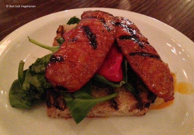 Grilled smoked chorizo on toast with piquillo pepper and rocket at Casa Brindisa in London