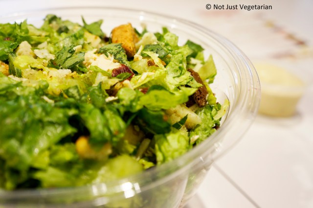 Autumn Chicken Caesar salad (romaine, shaved parmesan, bartlett pears, cranberries, multi-grain croutons, grilled chicken) at Just Salad in NYC