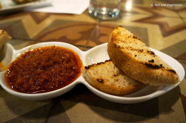 Crostoncini - grilled bread served with a sun-dried tomato, olive and caper dipping sauce - at Rossopomodoro on Fulham Road, London