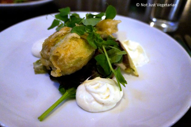 Courgette Flower - Filled with fava bean, feta cheese mint and pine nuts, cooked in a crispy batter with puy lentil salsa and preserved lemon aioli - at The Gate Islington - London