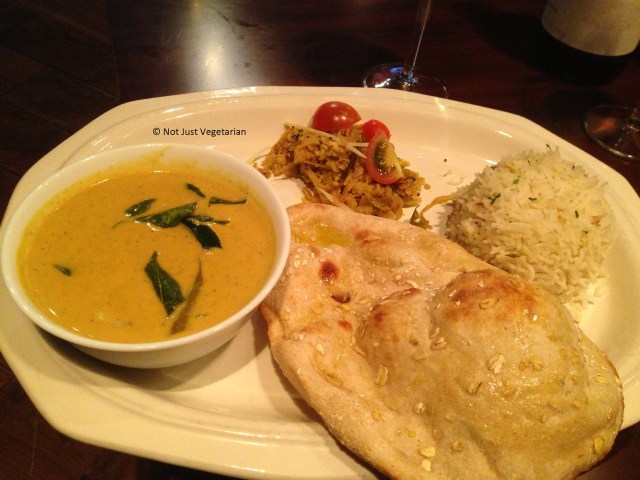 Goa Fish curry, shredded Cabbage Mysore Style with mixed cereal naan and steamed basmati rice at Indali Lounge in London