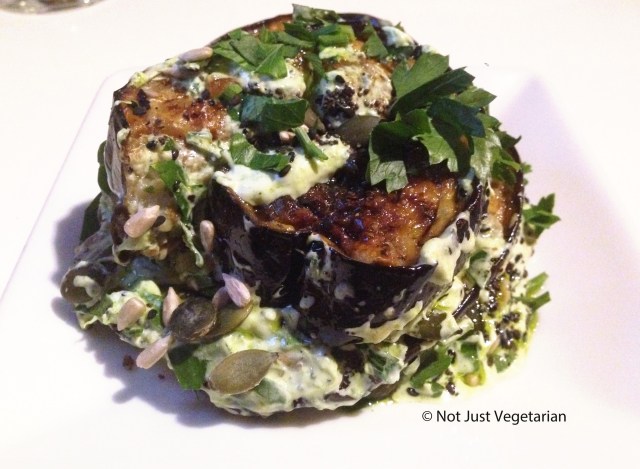 Roasted aubergine with parsely yoghrt, parsley oil and mixed seeds at Ottolenghi Islington in london
