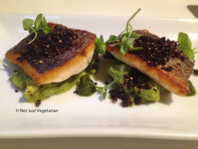 Pan-fried sea bass with a tomatillo, avocado and jalapeno salsa and olive soil at Ottolenghi Islington in London 