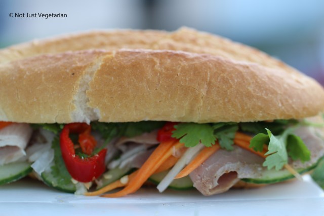Banh mi with sliced smoked pork shoulder, pickled carrots and daikon in a chili coriander dressing from The House of Ho at the Taste of London 2014